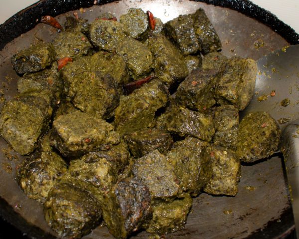 Then add cooked and cutted pieces of Patode and let them saute for some time.