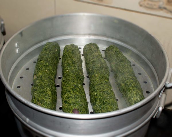 Grease steamer with oil and put on water for boiling. When steam starts to come out put rolls in a steamer and close the lid. Let it cook on low to medium flame.